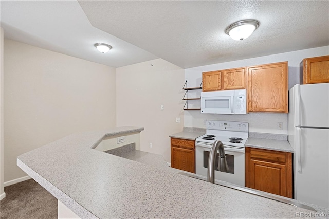 kitchen featuring kitchen peninsula, a textured ceiling, and white appliances