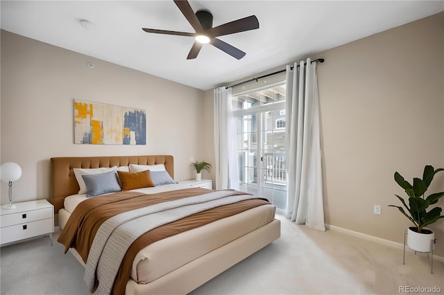 carpeted bedroom featuring ceiling fan and access to outside