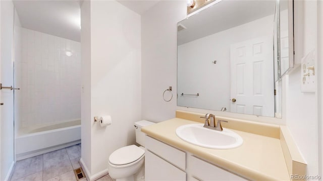 full bathroom with shower / tub combination, tile patterned flooring, toilet, vanity, and baseboards