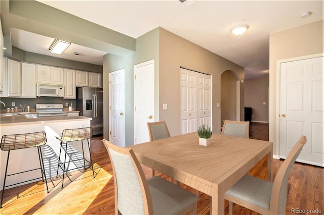 dining space featuring light wood-type flooring