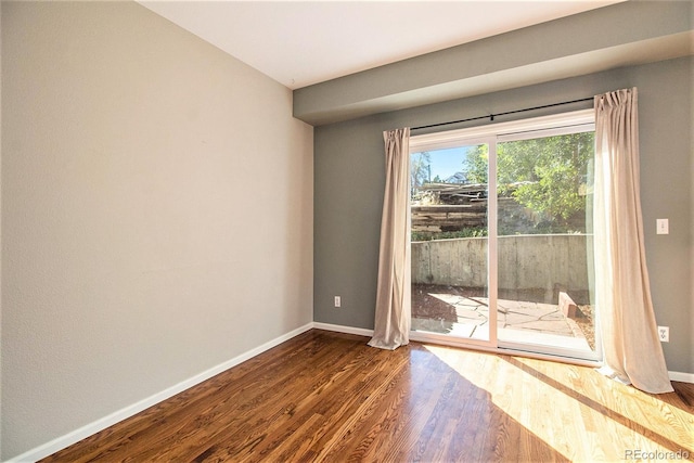 spare room with hardwood / wood-style flooring