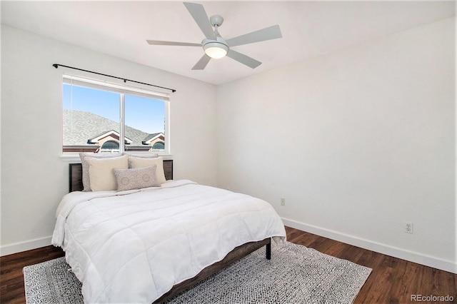 bedroom featuring ceiling fan and dark wood-type flooring