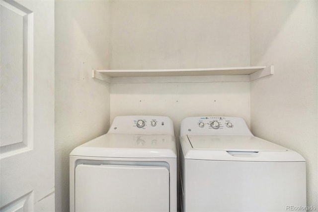 washroom with independent washer and dryer