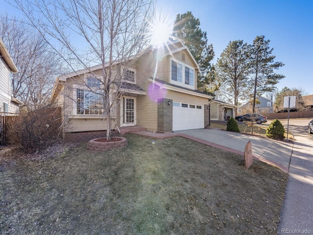 traditional-style home with a garage, concrete driveway, and brick siding