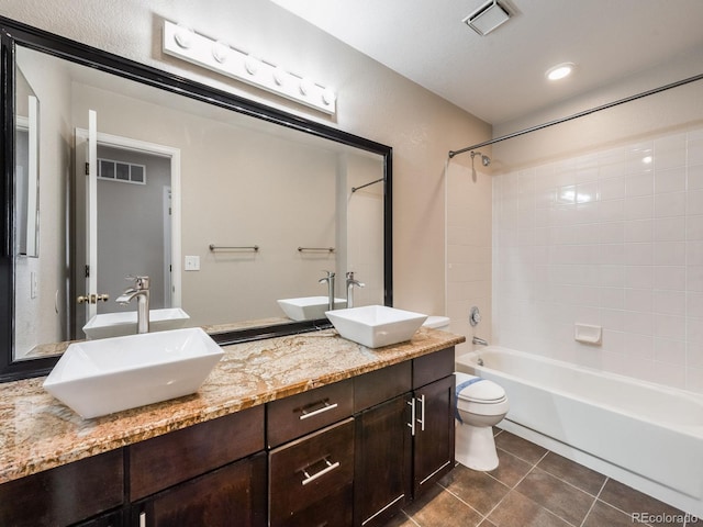 full bath with a sink, visible vents, and tile patterned floors