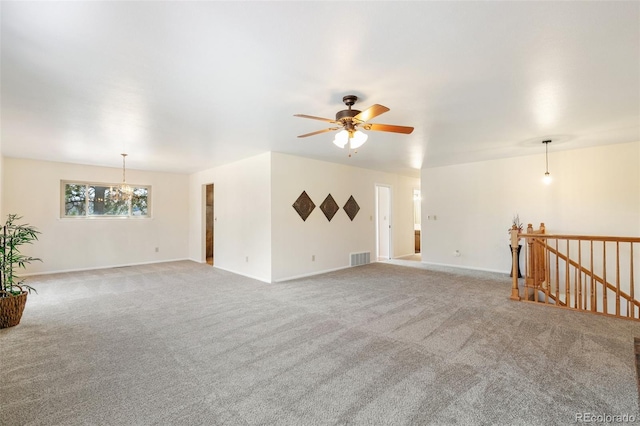 unfurnished living room featuring visible vents, carpet floors, baseboards, and ceiling fan