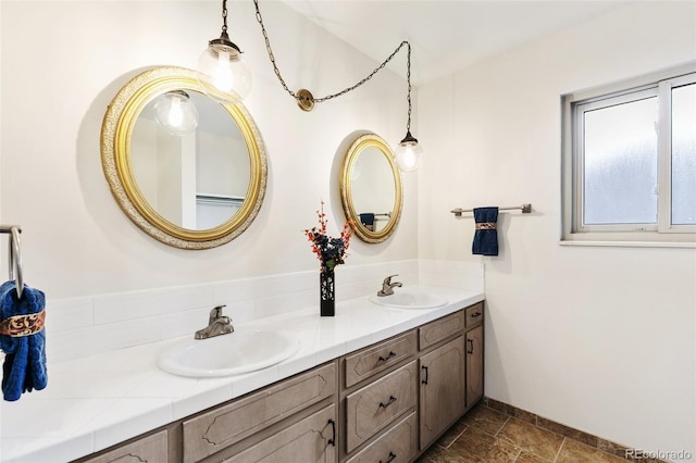 bathroom featuring double vanity and a sink