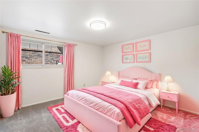 carpeted bedroom featuring visible vents and baseboards