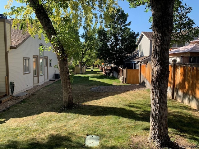 view of yard with central AC unit