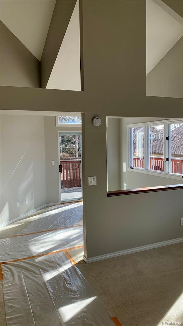 foyer entrance with high vaulted ceiling