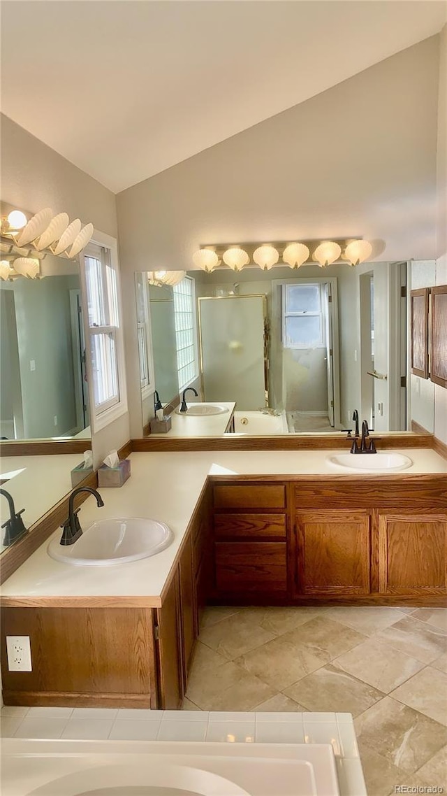 bathroom with lofted ceiling and vanity