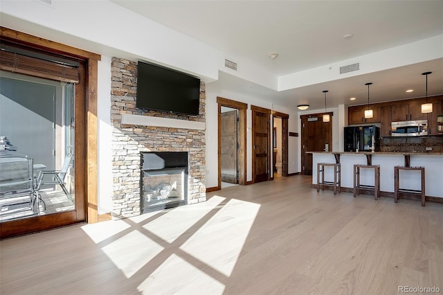 living room with light hardwood / wood-style floors