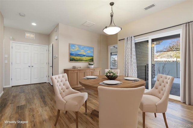 dining area featuring a wealth of natural light and dark hardwood / wood-style floors