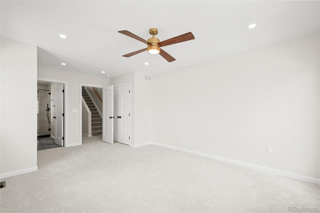 unfurnished bedroom with light carpet, baseboards, visible vents, and recessed lighting