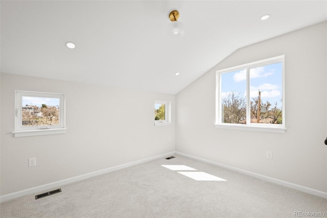 bonus room with carpet, visible vents, baseboards, and lofted ceiling