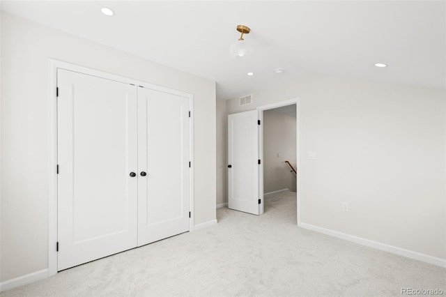 unfurnished bedroom featuring light colored carpet, baseboards, visible vents, and recessed lighting