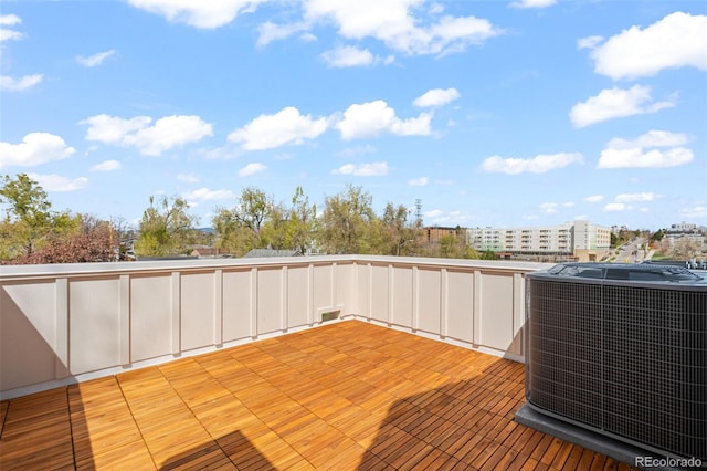 view of patio / terrace with central AC and a deck