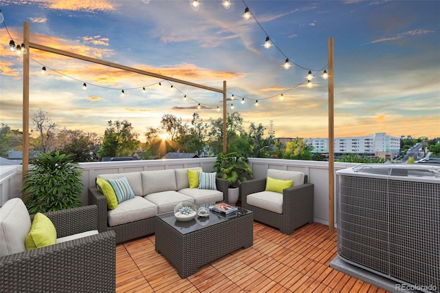 1052 N Knox Ct, Denver, CO 80204 - deck at dusk with an outdoor living space