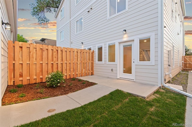 1052 N Knox Ct, Denver, CO 80204 - rear view of property with a fenced backyard and a patio