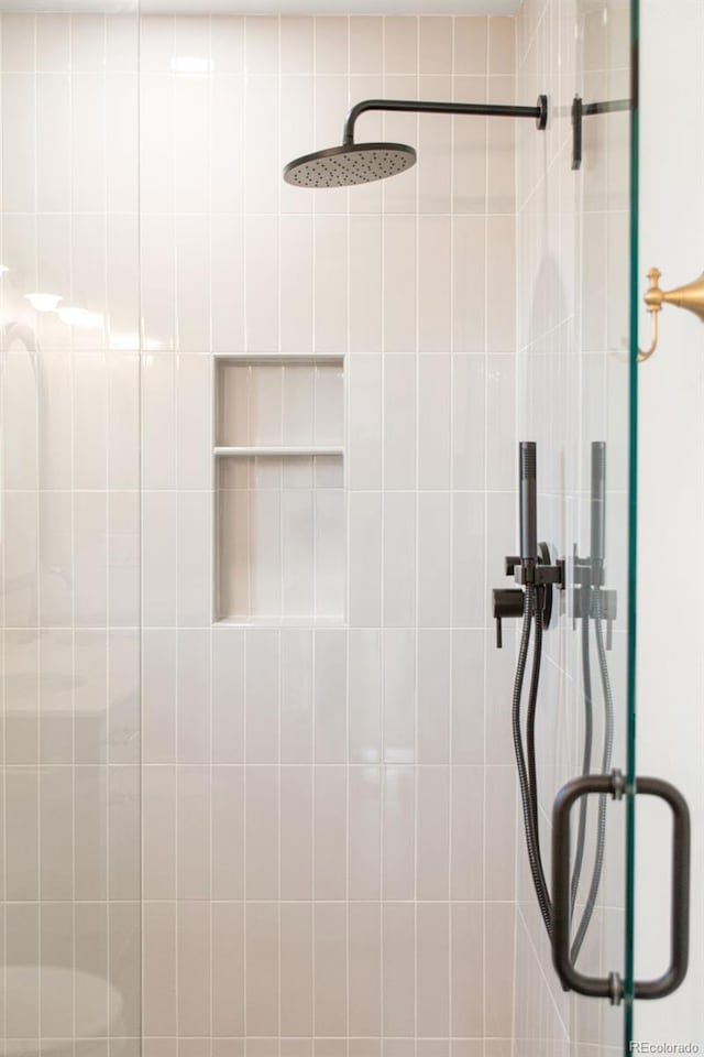 1052 N Knox Ct, Denver, CO 80204 - bathroom featuring a stall shower