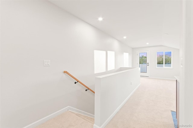 1052 N Knox Ct, Denver, CO 80204 - hallway featuring an upstairs landing, lofted ceiling, light colored carpet, baseboards, and recessed lighting