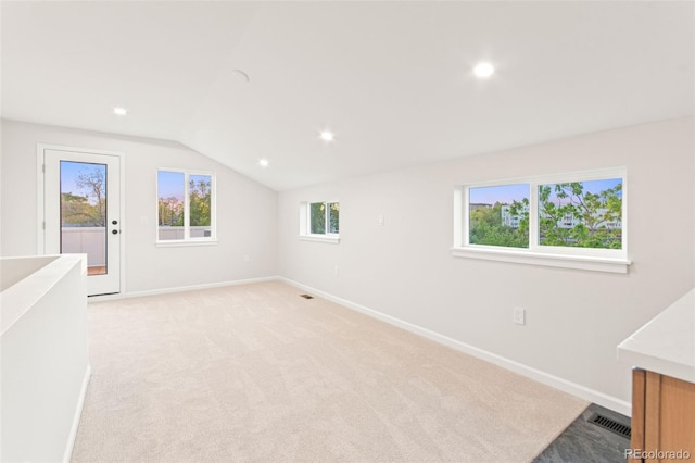 1052 N Knox Ct, Denver, CO 80204 - unfurnished room featuring light colored carpet, baseboards, lofted ceiling, and recessed lighting
