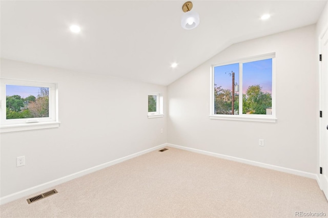 1052 N Knox Ct, Denver, CO 80204 - carpeted spare room featuring vaulted ceiling, baseboards, and recessed lighting
