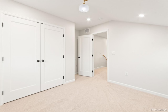 1052 N Knox Ct, Denver, CO 80204 - unfurnished bedroom with baseboards, light carpet, a closet, and recessed lighting