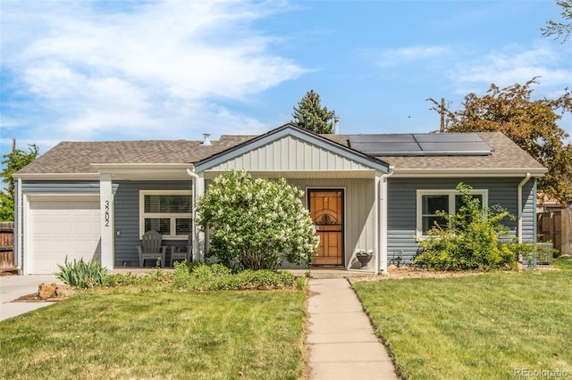 3202 S Dahlia St, Denver, CO 80222 - view of front of home featuring an attached garage, roof mounted solar panels, a shingled roof, concrete driveway, and a porch