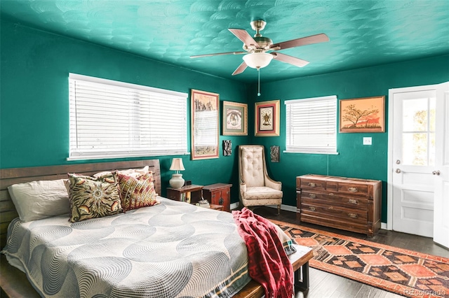 3202 S Dahlia St, Denver, CO 80222 - bedroom featuring wood finished floors, ceiling fan, and baseboards