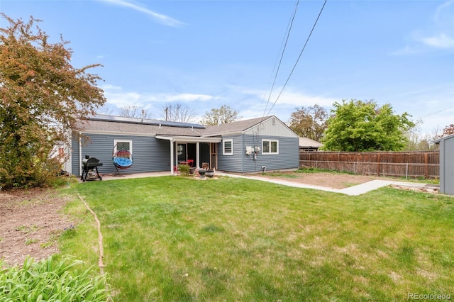 3202 S Dahlia St, Denver, CO 80222 - back of property featuring solar panels and a patio area