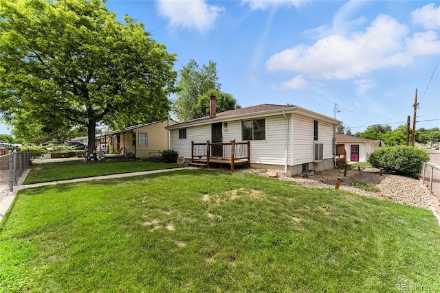4505 W Gill Pl, Denver, CO 80219 - back of house with a fenced backyard, a deck, and a chimney