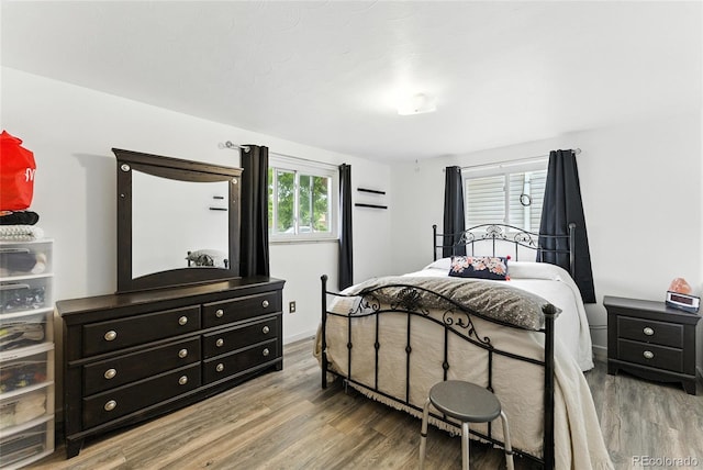 4505 W Gill Pl, Denver, CO 80219 - bedroom featuring wood finished floors and baseboards