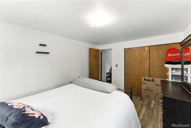 4505 W Gill Pl, Denver, CO 80219 - bedroom with dark wood-style flooring