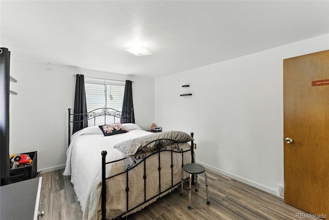 4505 W Gill Pl, Denver, CO 80219 - bedroom featuring wood finished floors and baseboards