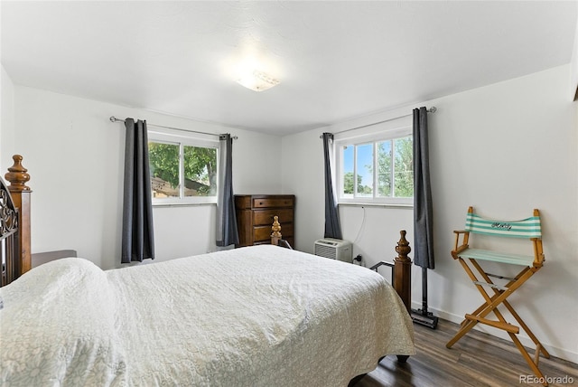 4505 W Gill Pl, Denver, CO 80219 - bedroom featuring dark wood finished floors and multiple windows