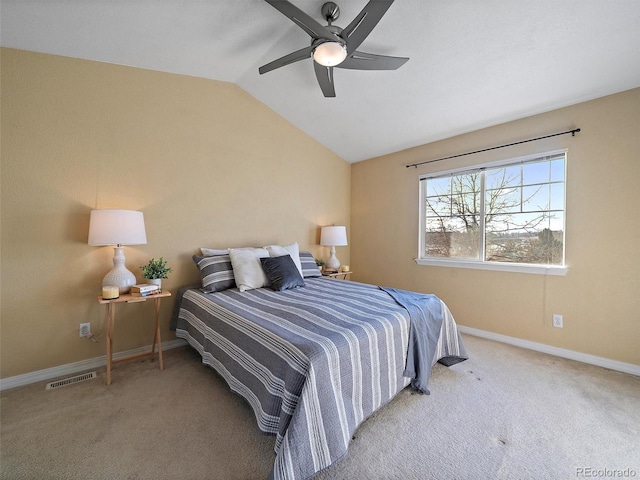 bedroom featuring lofted ceiling, light colored carpet, and ceiling fan