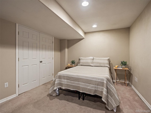 bedroom with light colored carpet