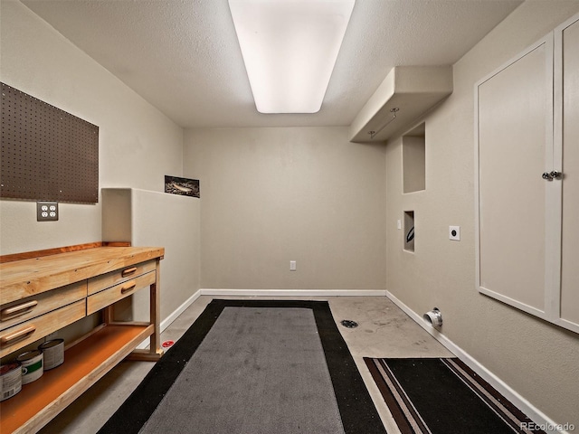 washroom featuring washer hookup, a textured ceiling, and electric dryer hookup