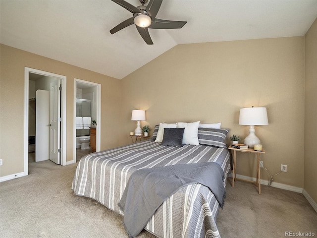 carpeted bedroom featuring ensuite bathroom, lofted ceiling, and ceiling fan