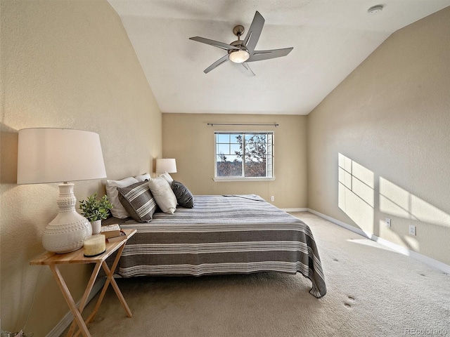 carpeted bedroom featuring ceiling fan and lofted ceiling