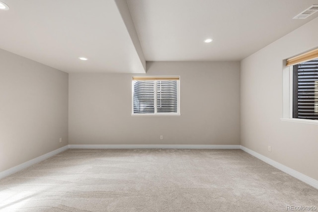 empty room with recessed lighting, visible vents, carpet floors, and baseboards