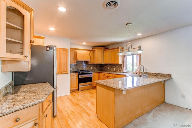16291 E 7th Dr, Aurora, CO 80011 - kitchen with appliances with stainless steel finishes, a sink, custom range hood, a peninsula, and light stone countertops