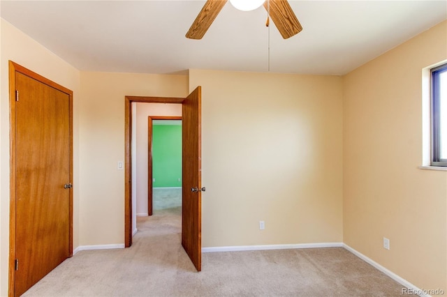 16291 E 7th Dr, Aurora, CO 80011 - unfurnished room featuring light colored carpet, a ceiling fan, and baseboards