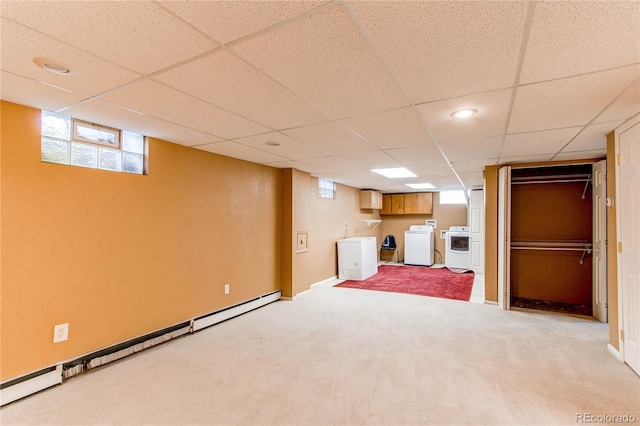16291 E 7th Dr, Aurora, CO 80011 - below grade area with washer and dryer, light colored carpet, a baseboard radiator, and a paneled ceiling