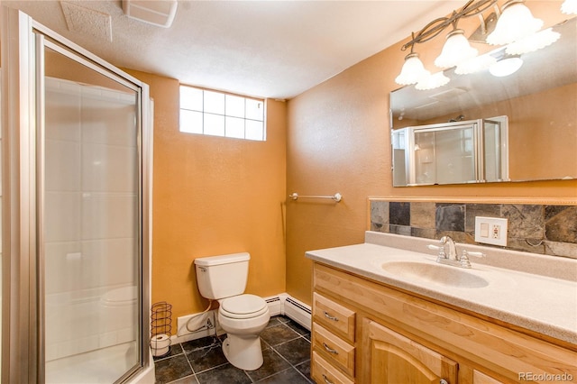 16291 E 7th Dr, Aurora, CO 80011 - bathroom with toilet, vanity, a stall shower, and tile patterned floors