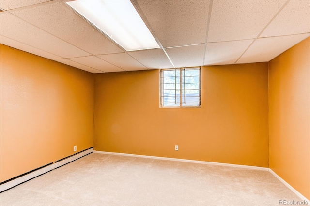 16291 E 7th Dr, Aurora, CO 80011 - basement with baseboard heating, carpet, a drop ceiling, and baseboards