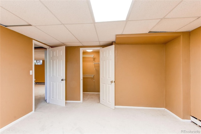 16291 E 7th Dr, Aurora, CO 80011 - unfurnished bedroom featuring a paneled ceiling, carpet floors, baseboards, and a walk in closet