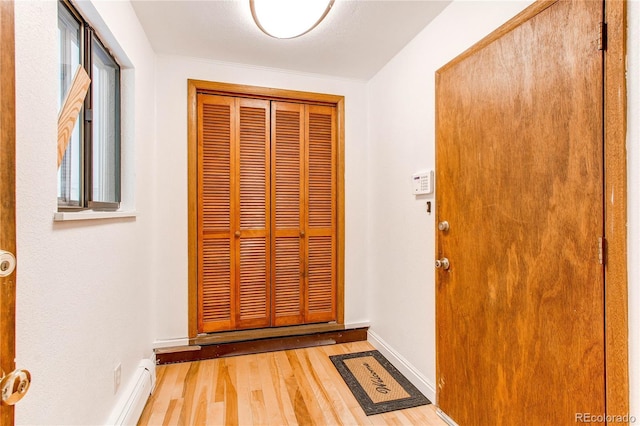 16291 E 7th Dr, Aurora, CO 80011 - foyer entrance with wood finished floors and baseboards