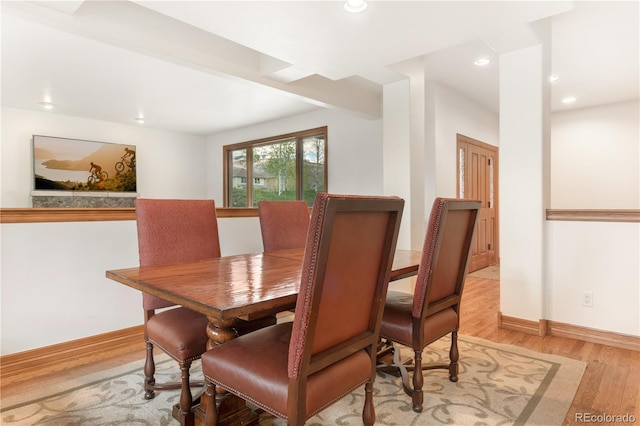 dining space featuring light wood-type flooring